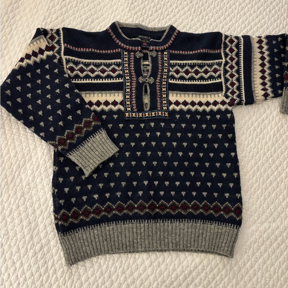 Devold blue 1853 traditional sweater by Olmes Carretti in a small.